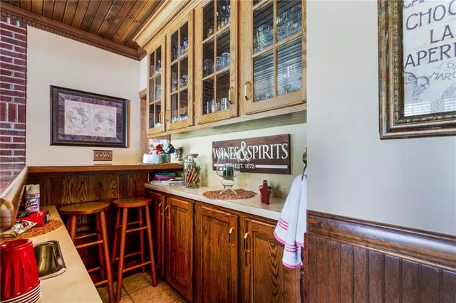 a utility room with multiple dryer and washer