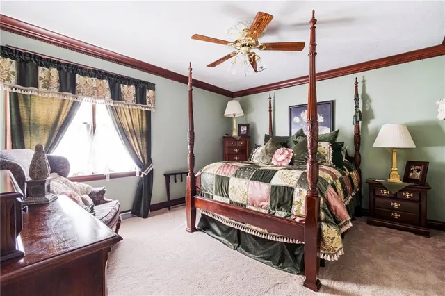 a bedroom with furniture and a window