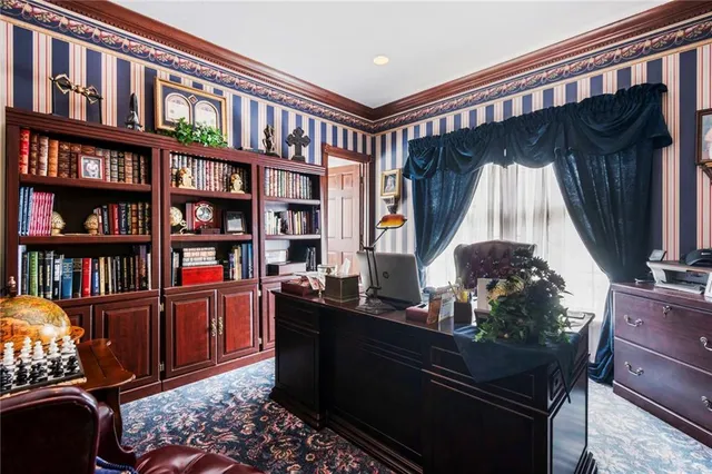 a living room with hard wood flooring and a couch