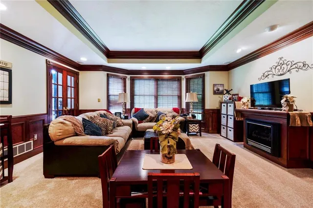 a living room with furniture fireplace and flat screen tv