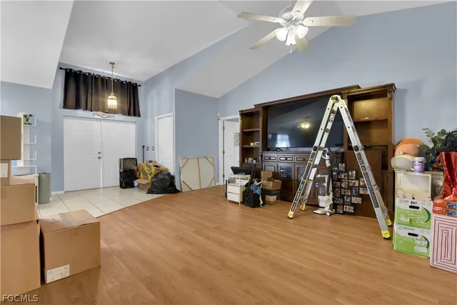 a view of a livingroom with furniture and a flat screen tv