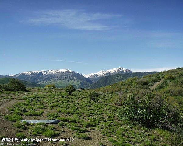 0 Rabbit Way Snowmass, CO 81654 - Photo 11 of 23 a view of a lush green hillside and a mountain view