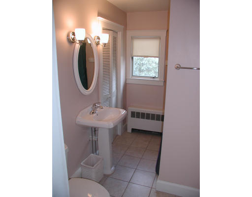 6 Decatur Street Gloucester, MA 01930 - Photo 12 of 13 a bathroom with a sink a toilet and a mirror