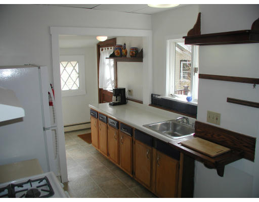 6 Decatur Street Gloucester, MA 01930 - Photo 10 of 13 a kitchen with sink stove and refrigerator