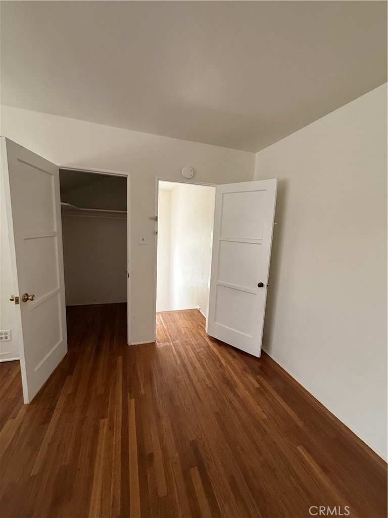 4121 4th Street Riverside, CA 92501 - Photo 13 of 25 an empty room with wooden floor and closet