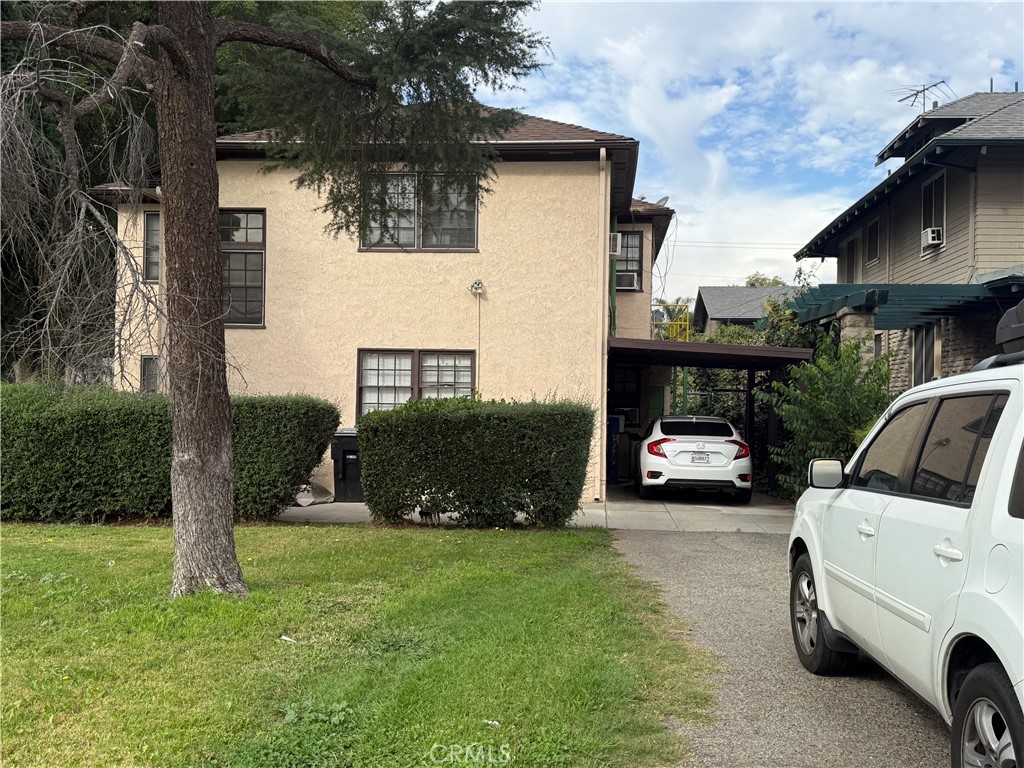 4121 4th Street Riverside, CA 92501 - Photo 2 of 25 a view of a car in front of house