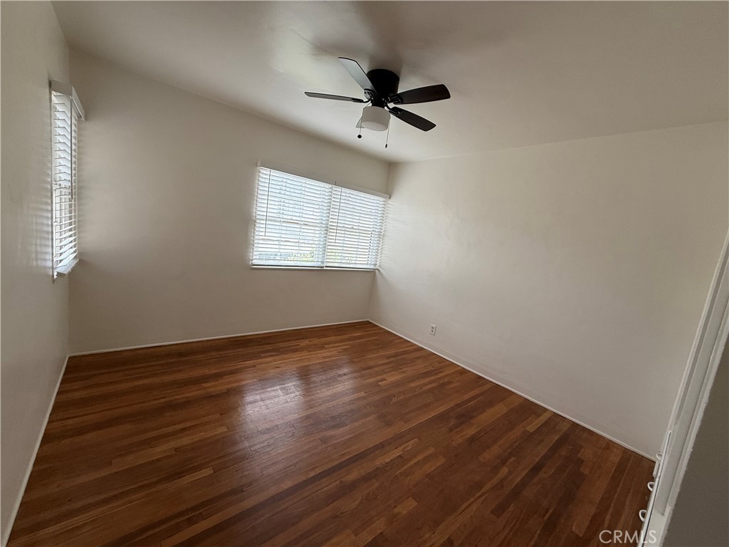 4121 4th Street Riverside, CA 92501 - Photo 10 of 25 a view of an empty room with wooden floor and a window