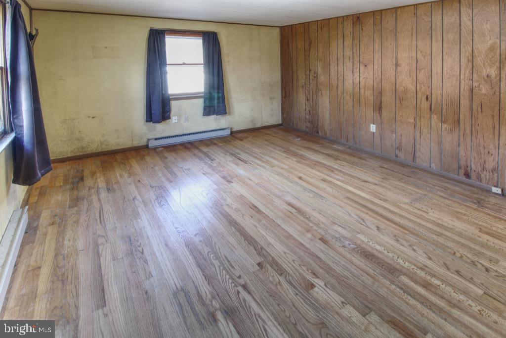 4417 Buffalo Road Mount Airy, MD 21771 - Photo 16 of 30 Spacious room with natural light and wood accents.