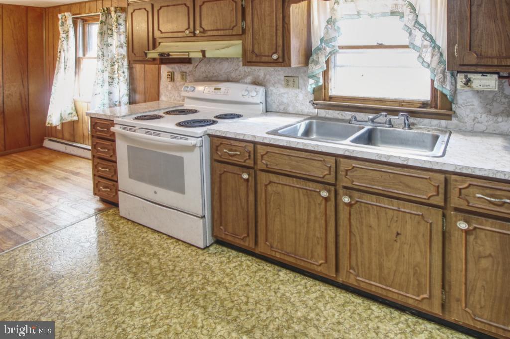 4417 Buffalo Road Mount Airy, MD 21771 - Photo 10 of 30 Cozy kitchen with classic wooden cabinetry.