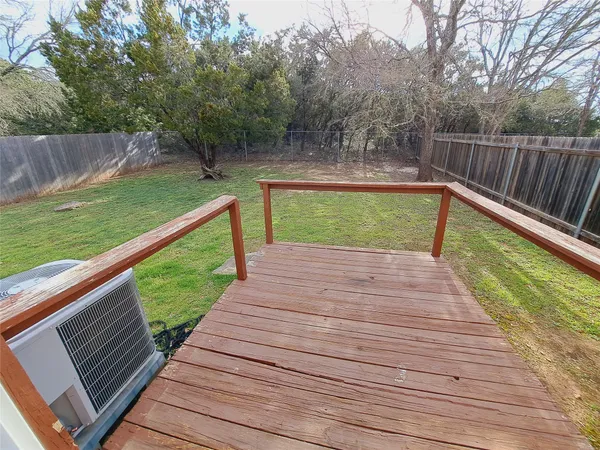 a view of deck with a yard
