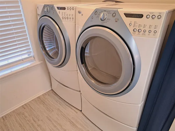 a utility room with dryer and washer