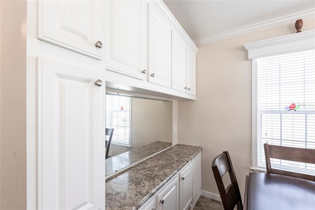 1329 Trout Punta Gorda, FL 33950 - Photo 12 of 38 a view of a kitchen with fridge and wooden floor