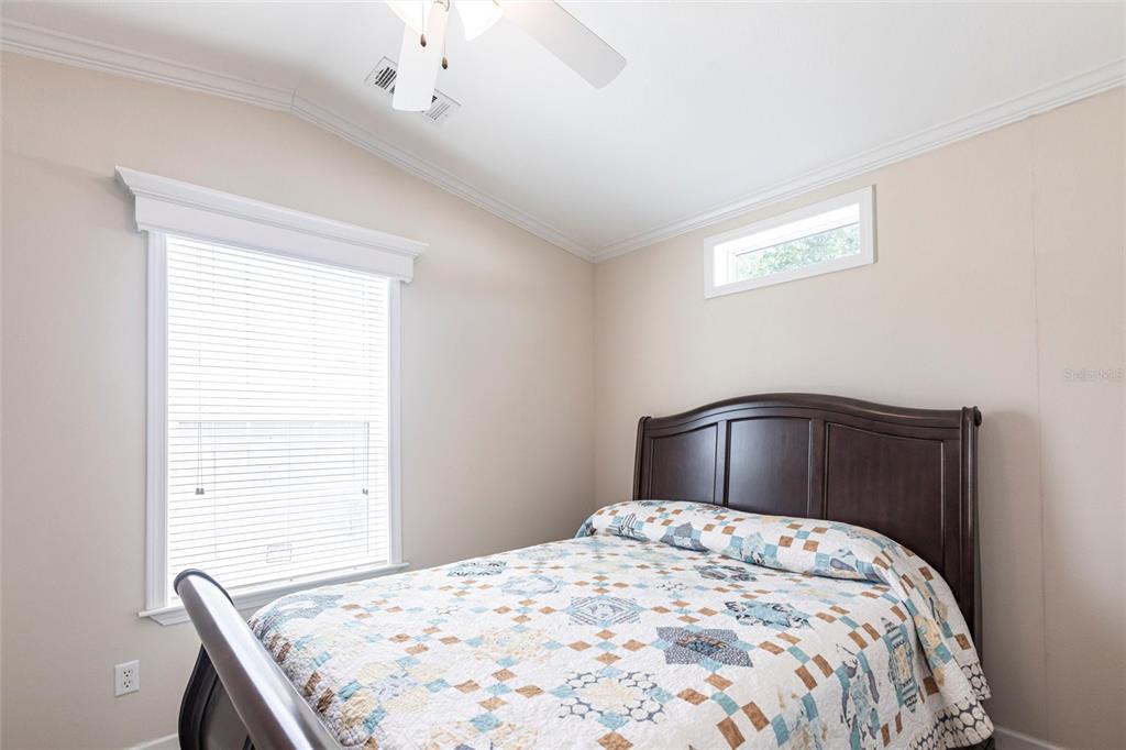 1329 Trout Punta Gorda, FL 33950 - Photo 17 of 38 a bedroom with a bed and a window