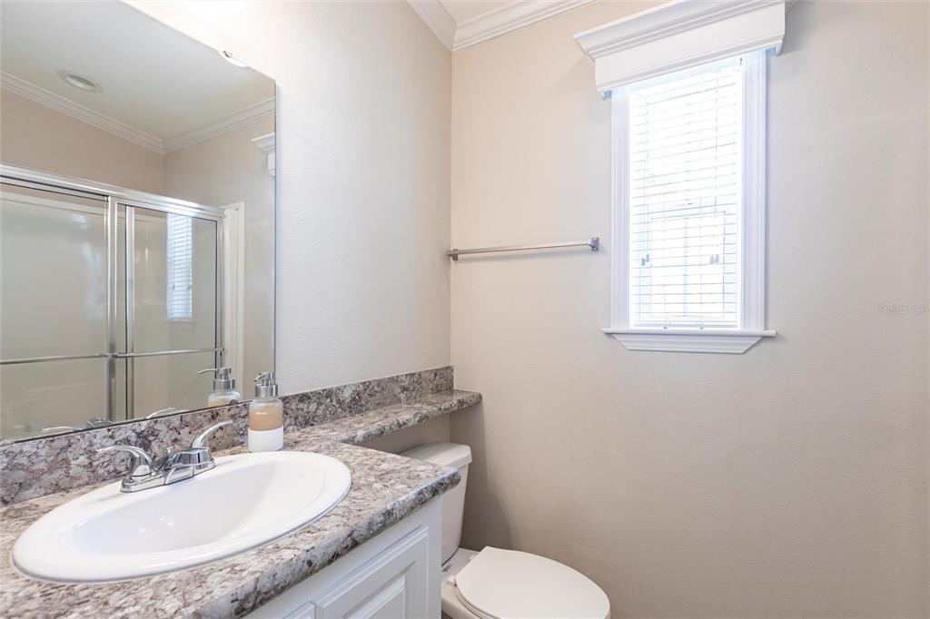 1329 Trout Punta Gorda, FL 33950 - Photo 20 of 38 a bathroom with a granite countertop toilet a sink and a mirror