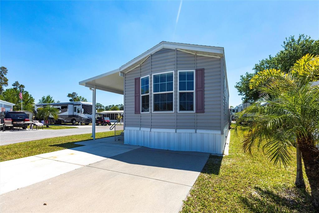 1329 Trout Punta Gorda, FL 33950 - Photo 2 of 38 a front view of a house with a yard