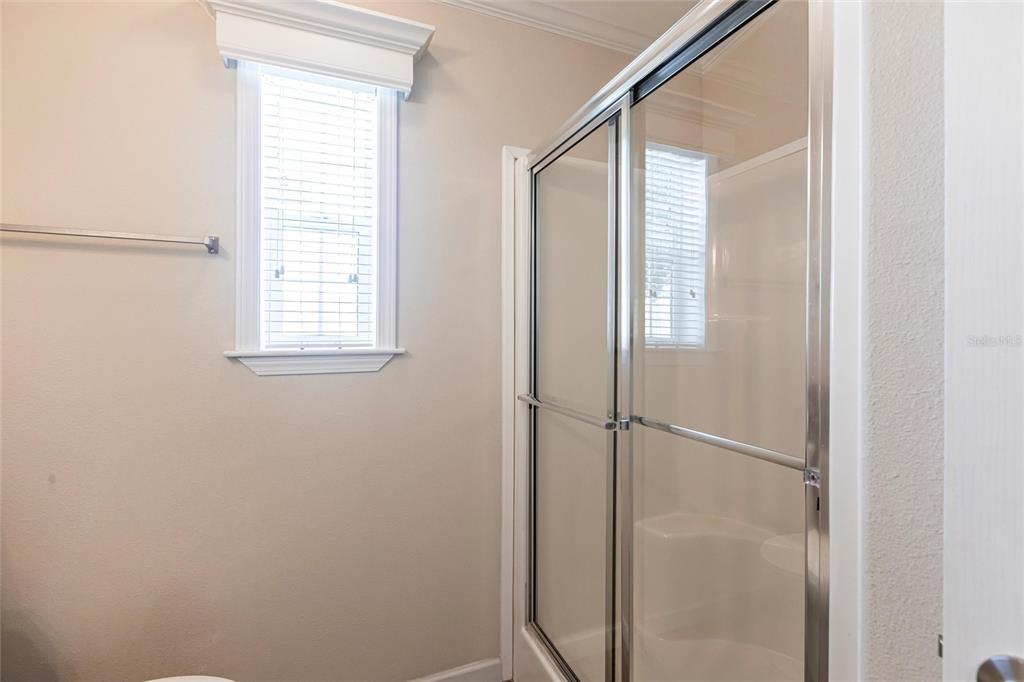 1329 Trout Punta Gorda, FL 33950 - Photo 21 of 38 a bathroom with a glass shower door