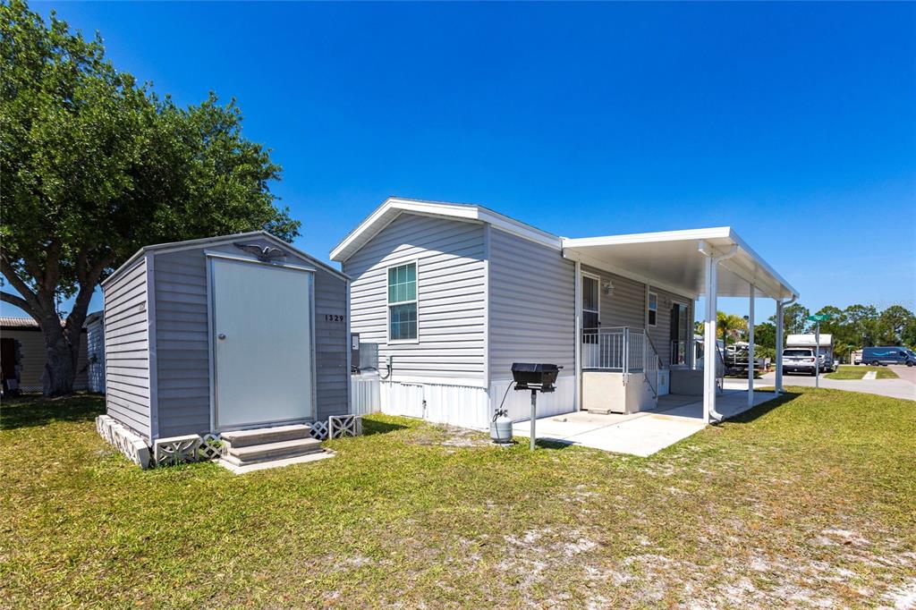 1329 Trout Punta Gorda, FL 33950 - Photo 22 of 38 a view of a house with a yard