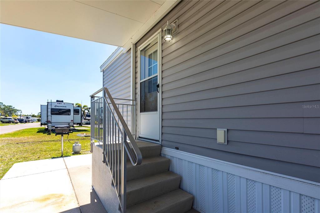 1329 Trout Punta Gorda, FL 33950 - Photo 3 of 38 a view of a swimming pool with a lounge chairs