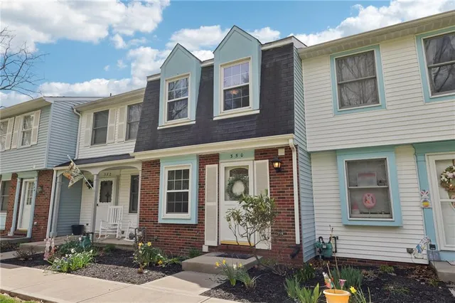 a front view of a house with outdoor space