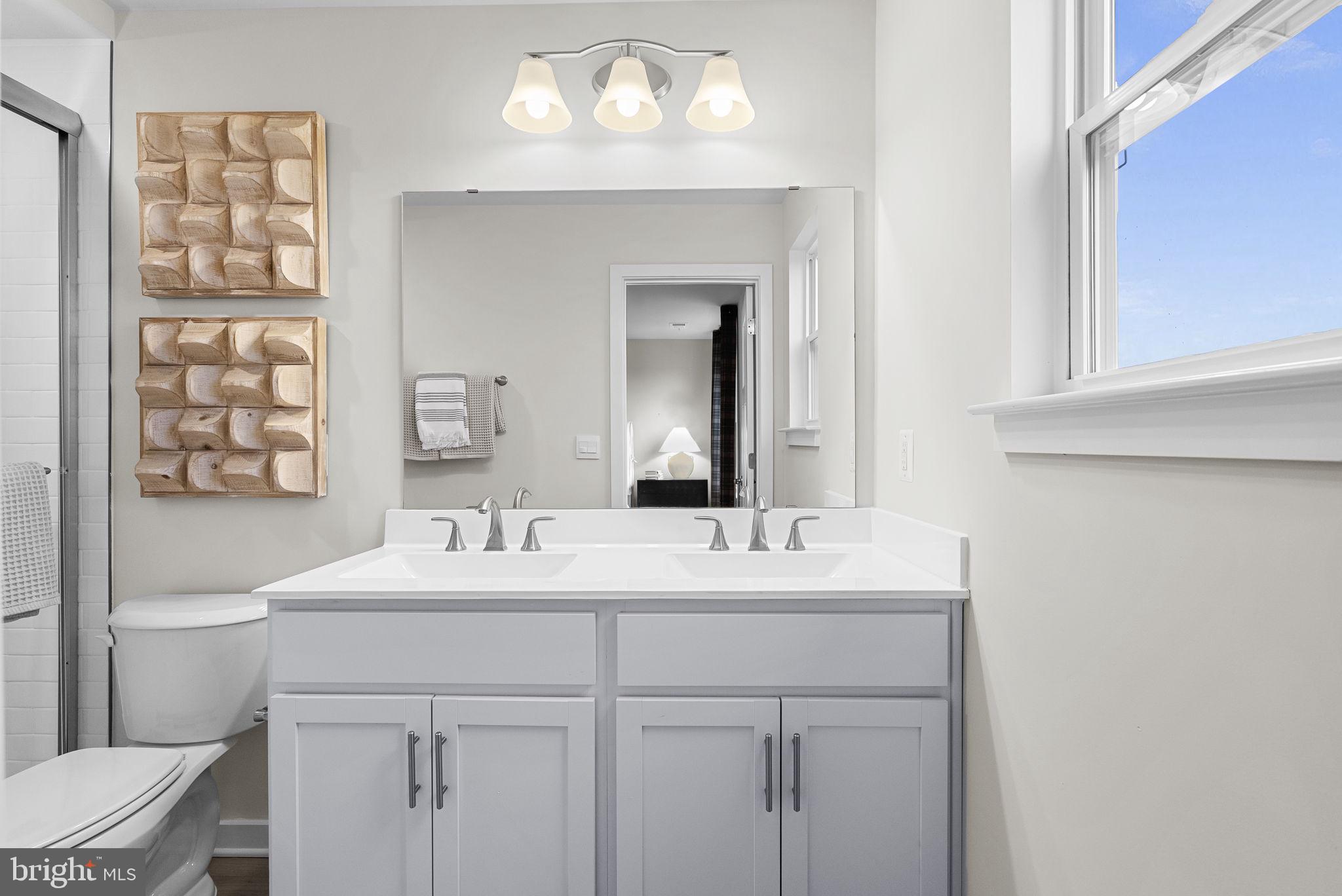 176 Monroe Avenue Ranson, WV 25438 - Photo 33 of 47 a bathroom with a sink vanity and a mirror