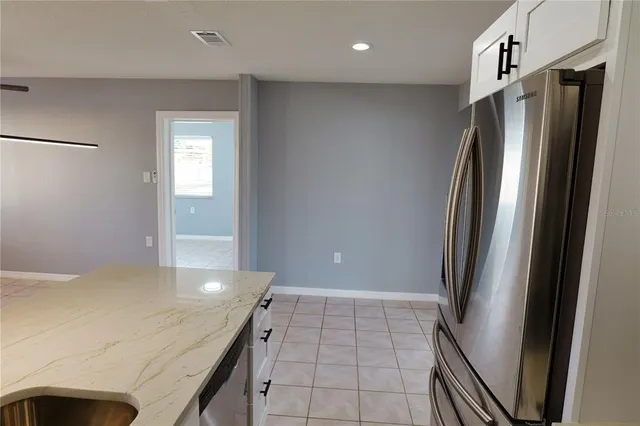 a kitchen with stainless steel appliances a refrigerator and a sink