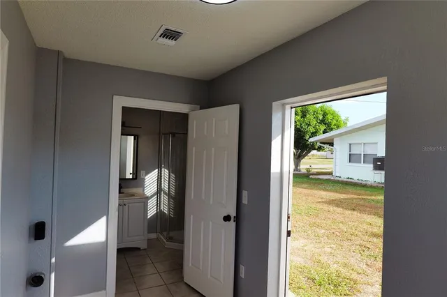 a view of an empty room and window