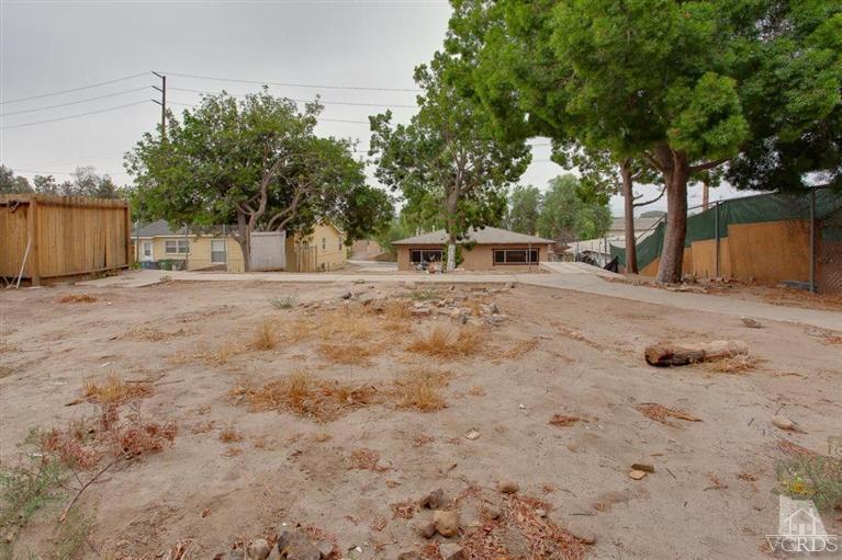 445 Charles Street Moorpark, CA 93021 - Photo 11 of 24 a row of dirt field with trees in the background