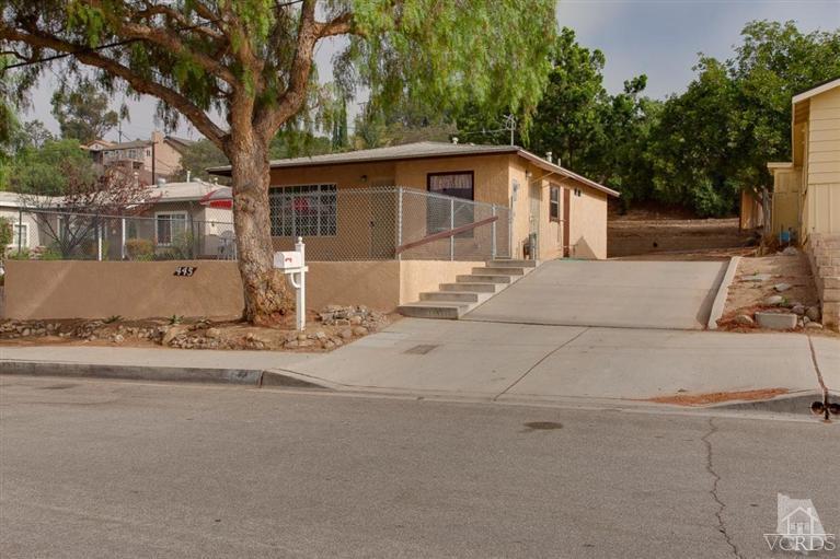 445 Charles Street Moorpark, CA 93021 - Photo 7 of 24 a front view of a house with a yard