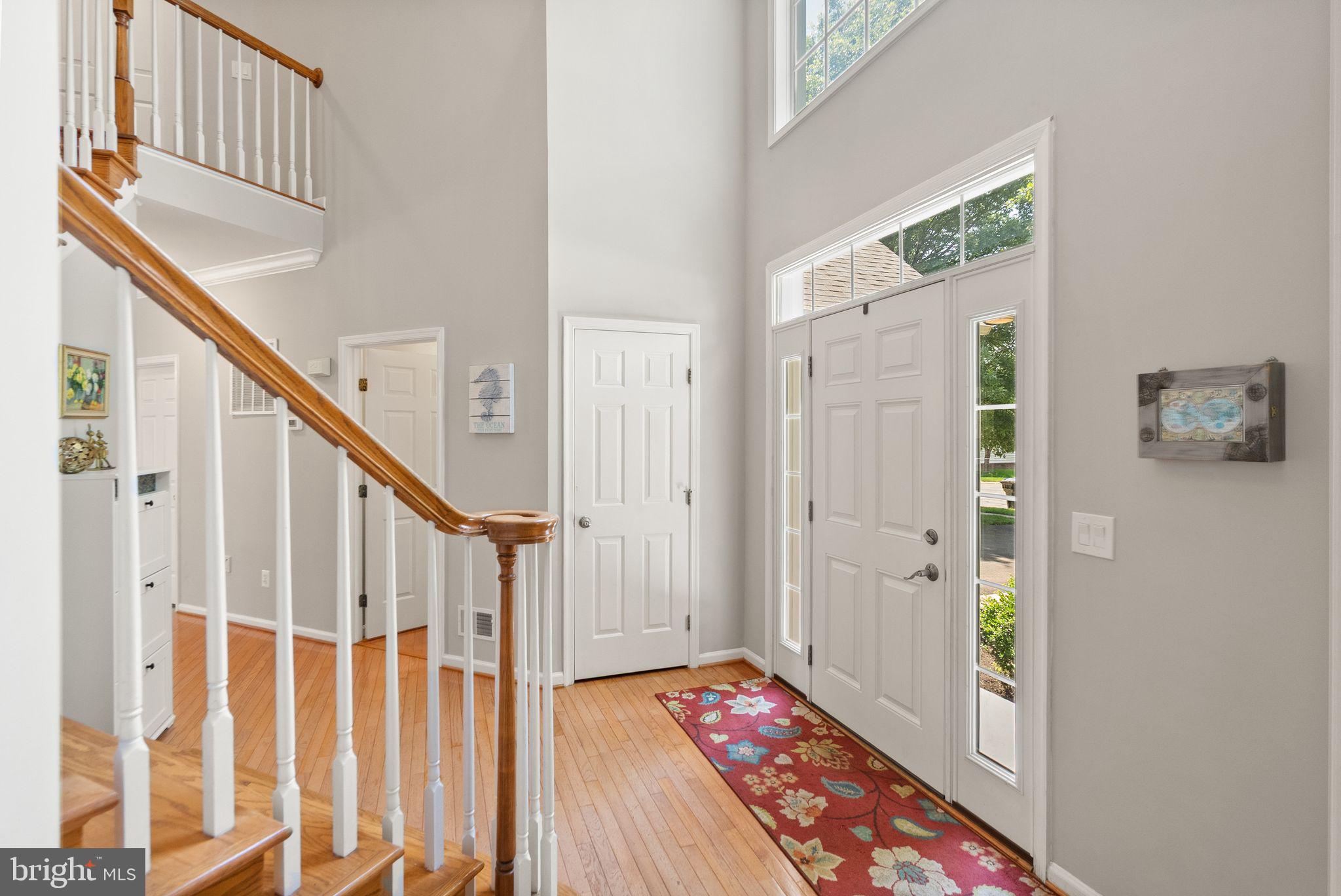 6901 Bitterroot Court Gainesville, VA 20155 - Photo 11 of 98 a view of an entryway with wooden floor