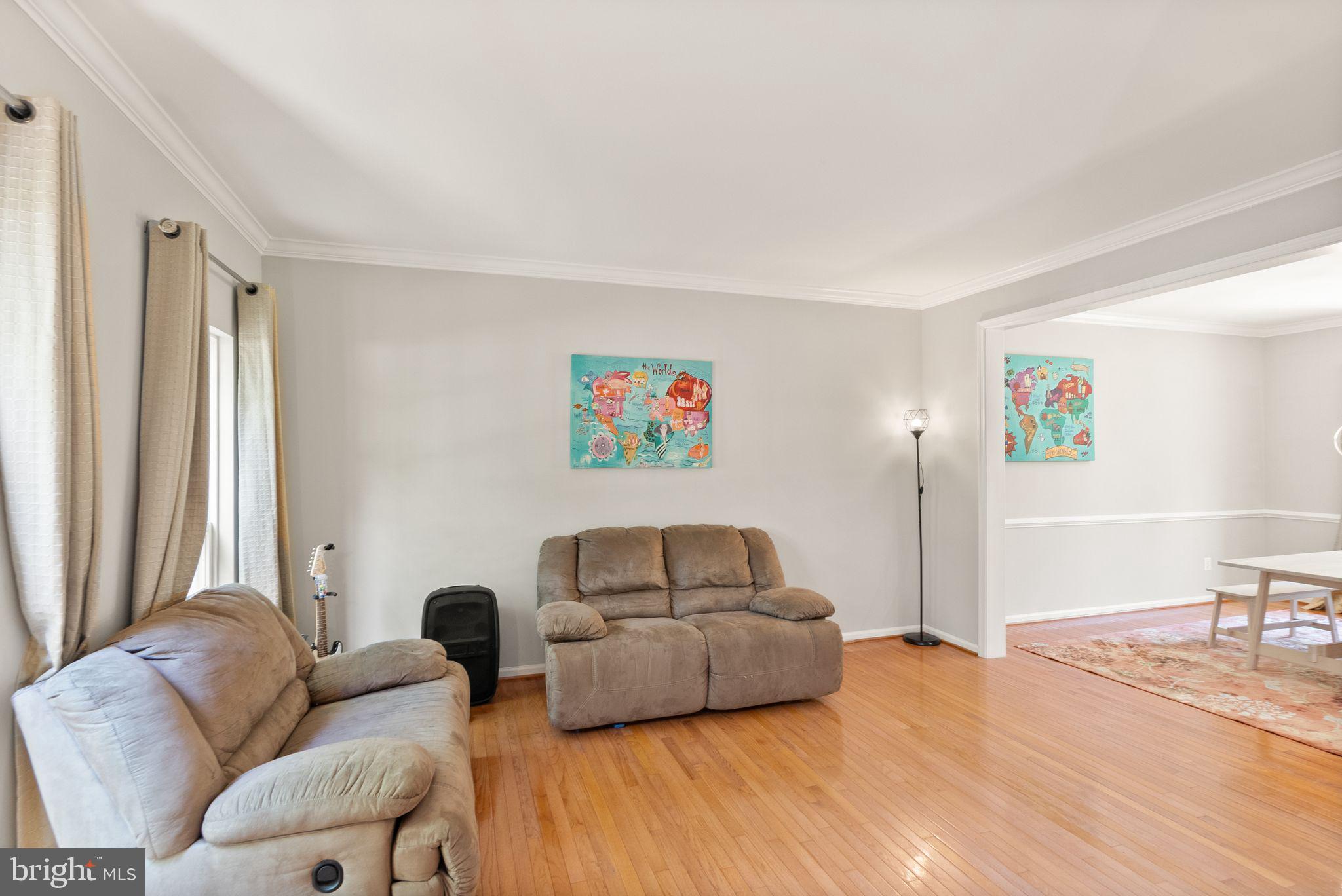 6901 Bitterroot Court Gainesville, VA 20155 - Photo 13 of 98 a living room with furniture and a window