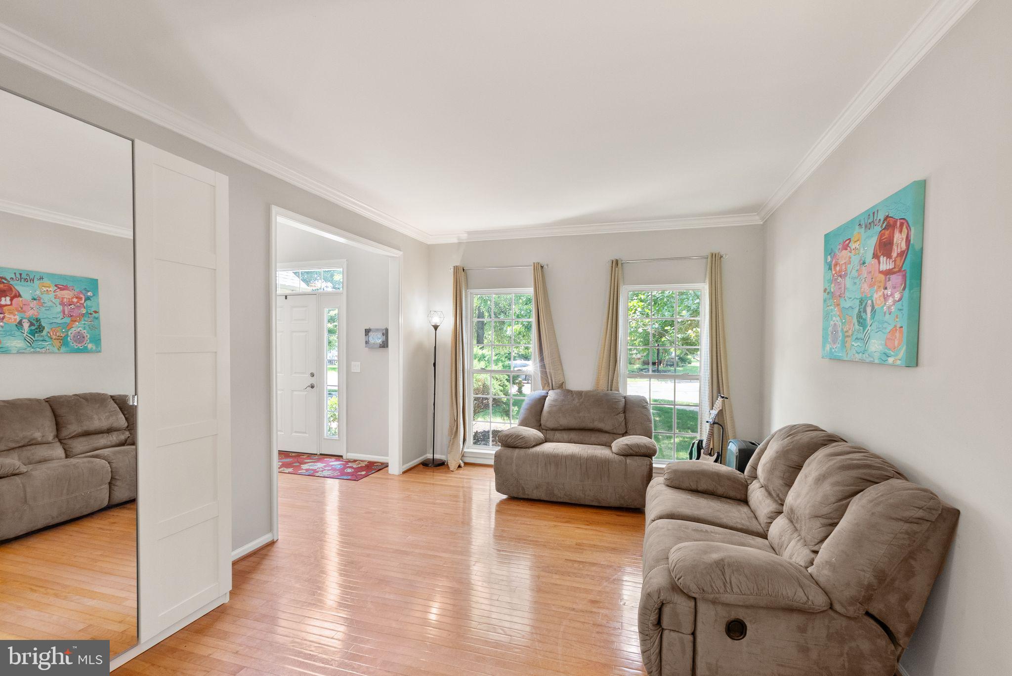 6901 Bitterroot Court Gainesville, VA 20155 - Photo 14 of 98 a living room with furniture window and wooden floor