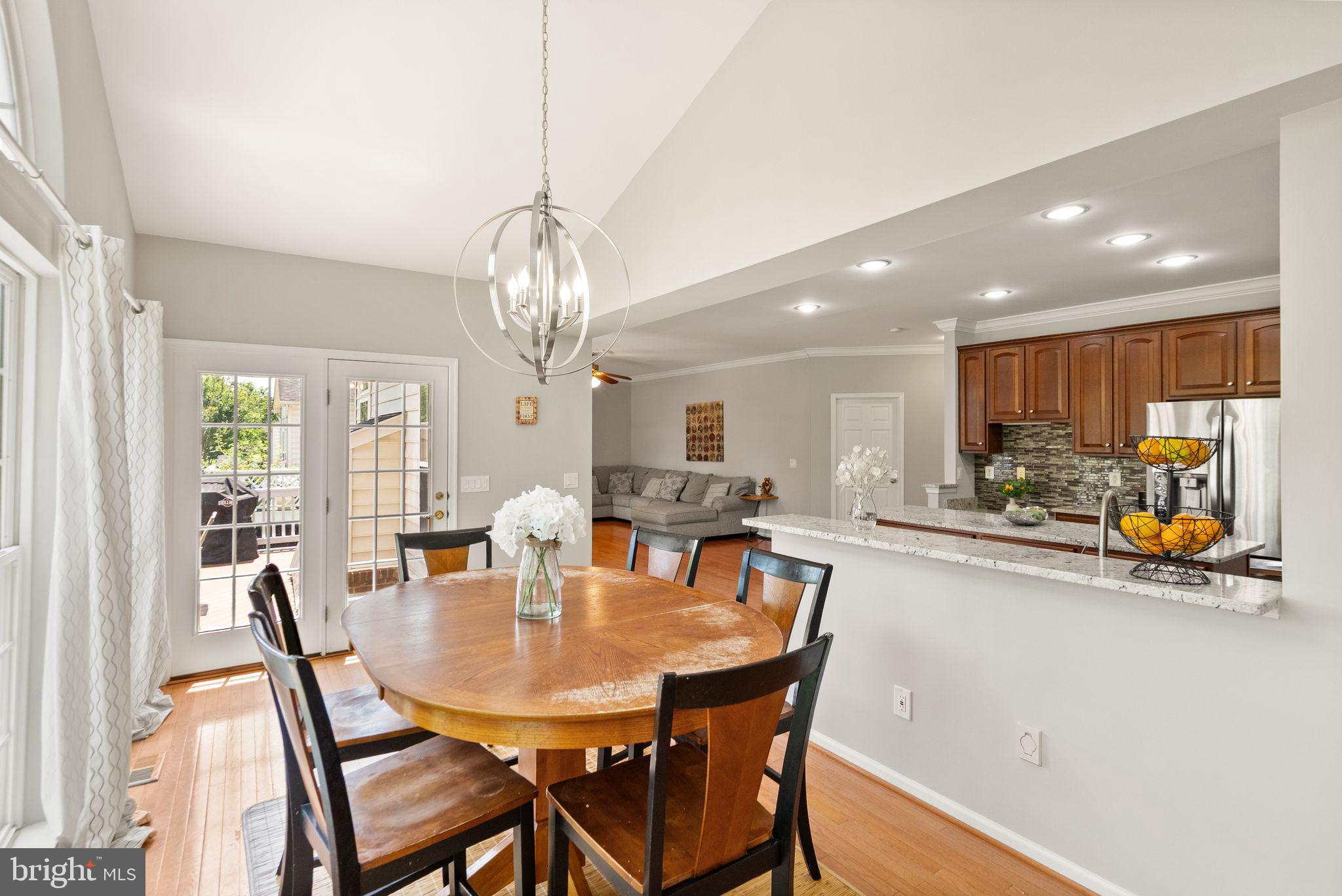 6901 Bitterroot Court Gainesville, VA 20155 - Photo 23 of 98 a view of a dining room with furniture and chandelier