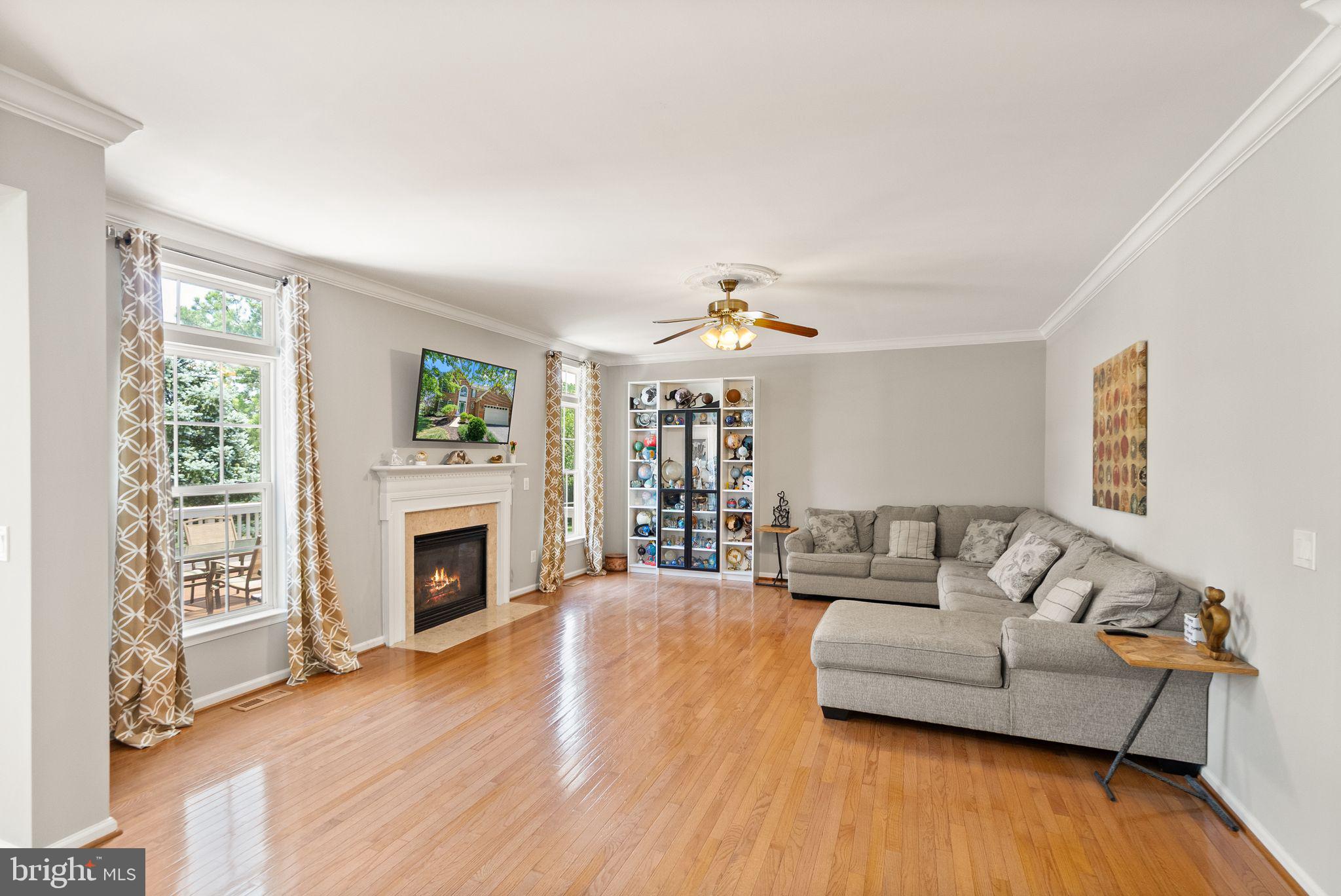 6901 Bitterroot Court Gainesville, VA 20155 - Photo 24 of 98 a living room with furniture and a fireplace