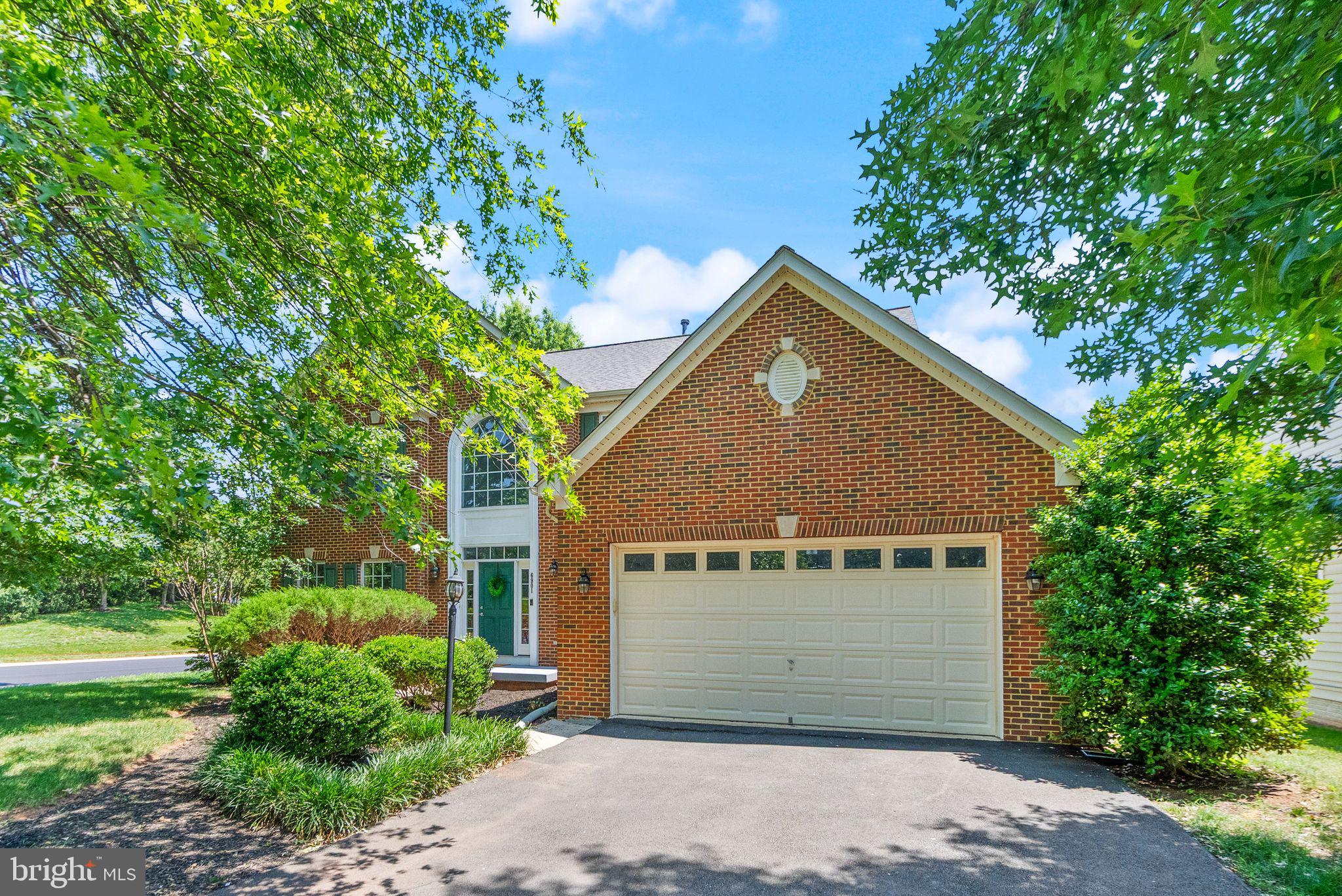 6901 Bitterroot Court Gainesville, VA 20155 - Photo 3 of 98 a front view of a house with a garage