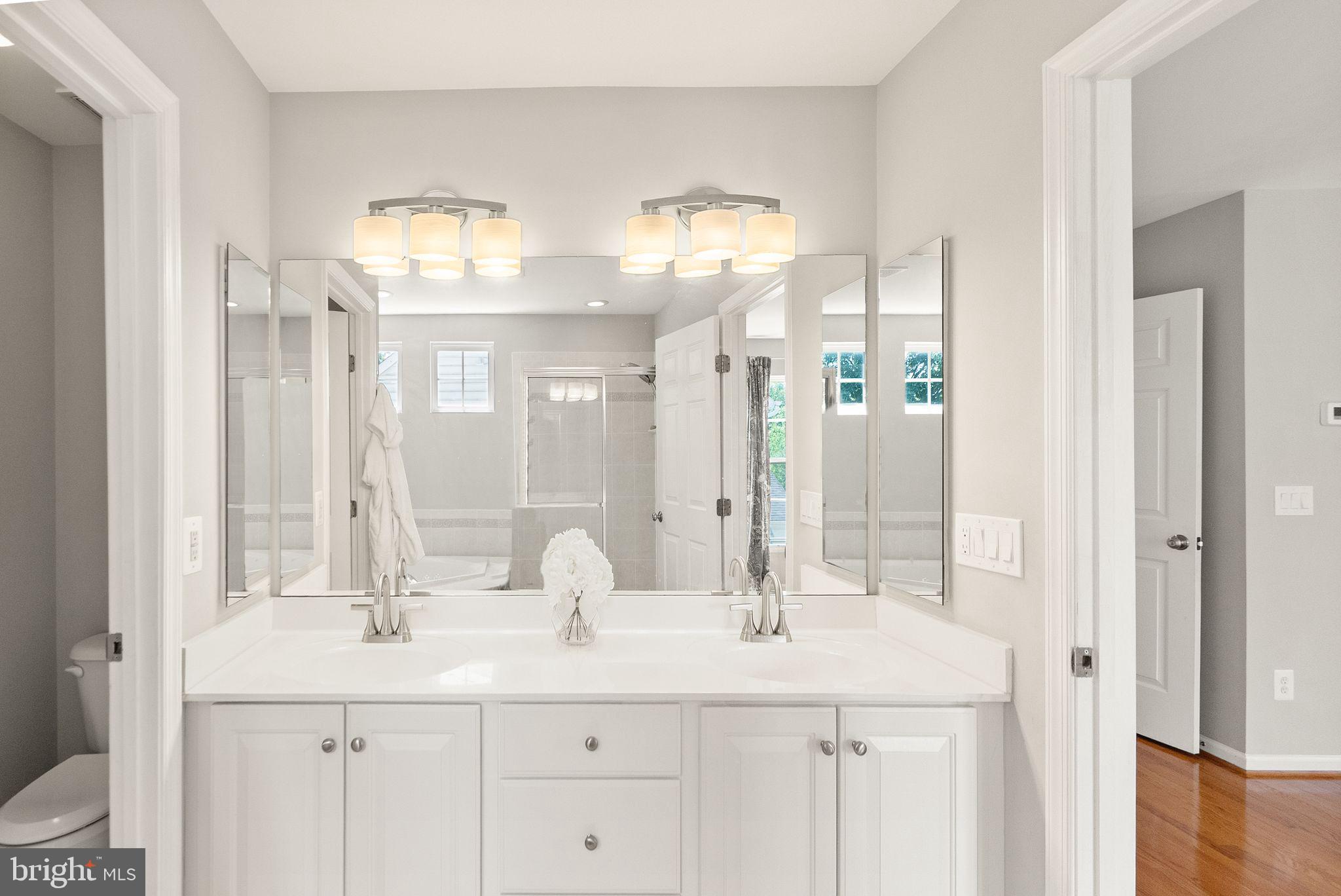 6901 Bitterroot Court Gainesville, VA 20155 - Photo 37 of 98 a bathroom with double sink and a mirror
