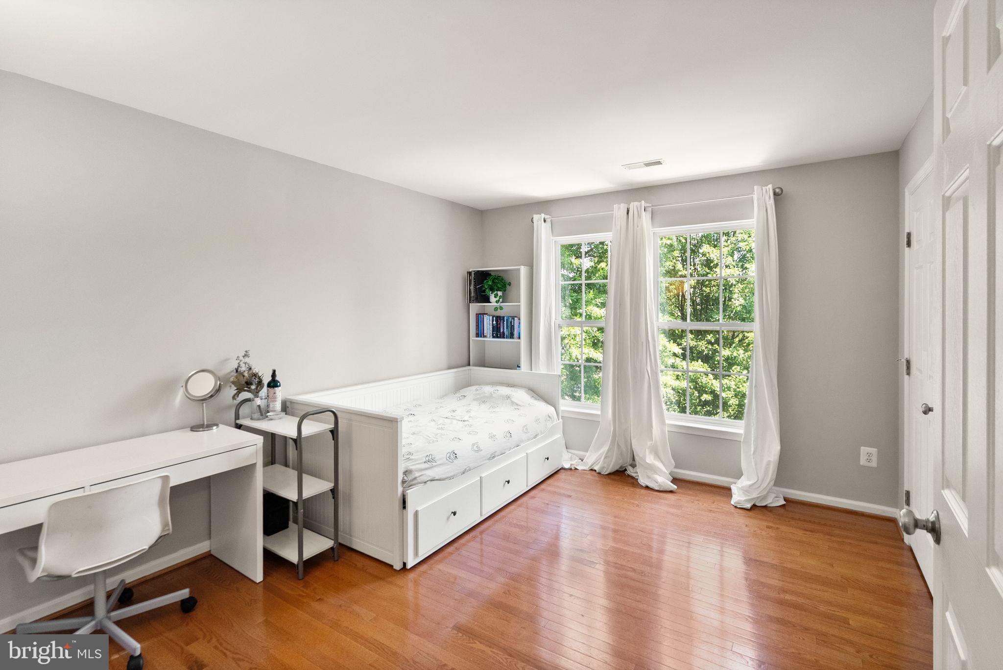 6901 Bitterroot Court Gainesville, VA 20155 - Photo 43 of 98 a bed room with a bed and a chair