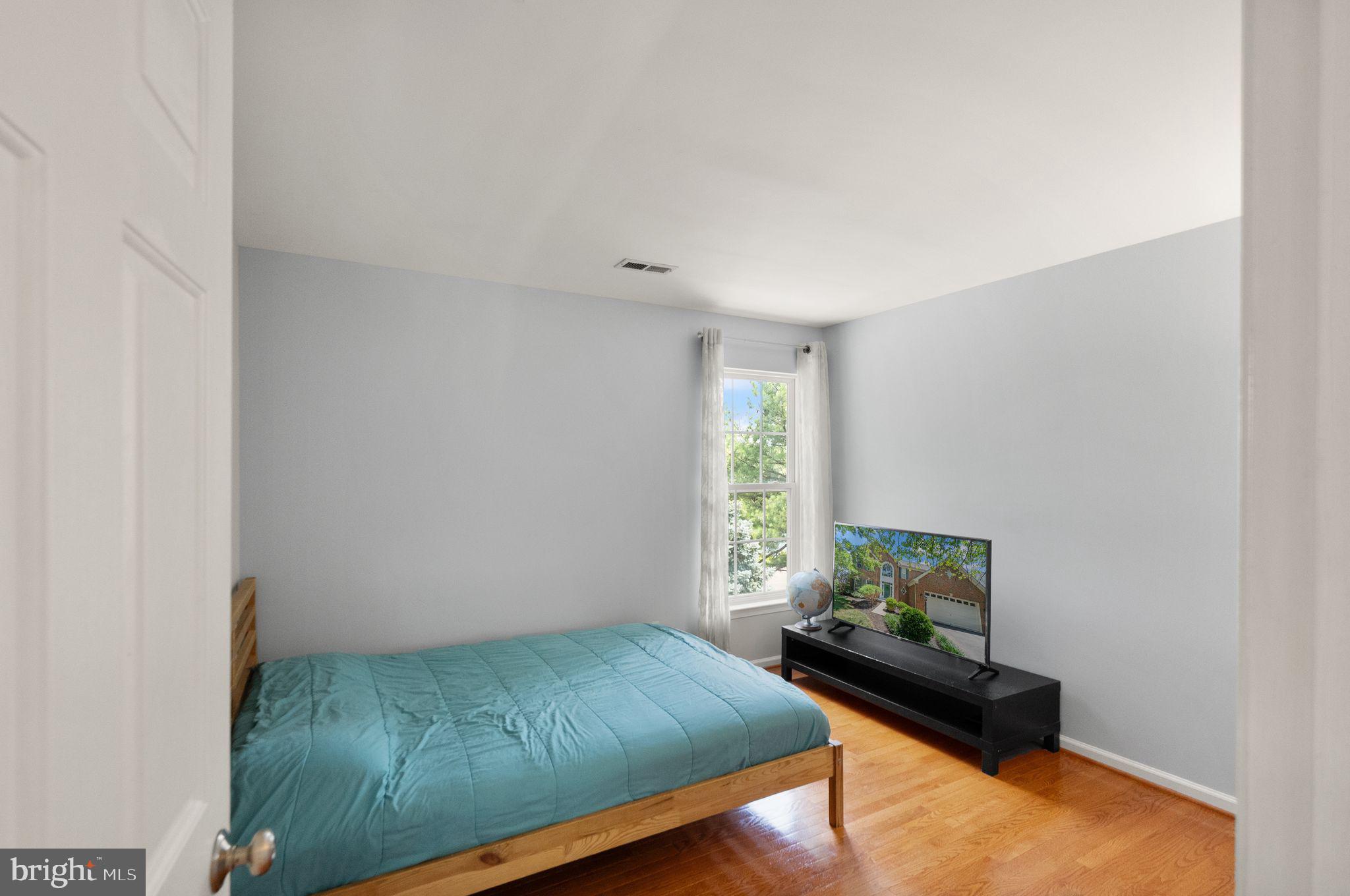 6901 Bitterroot Court Gainesville, VA 20155 - Photo 45 of 98 a bedroom with a bed and a window