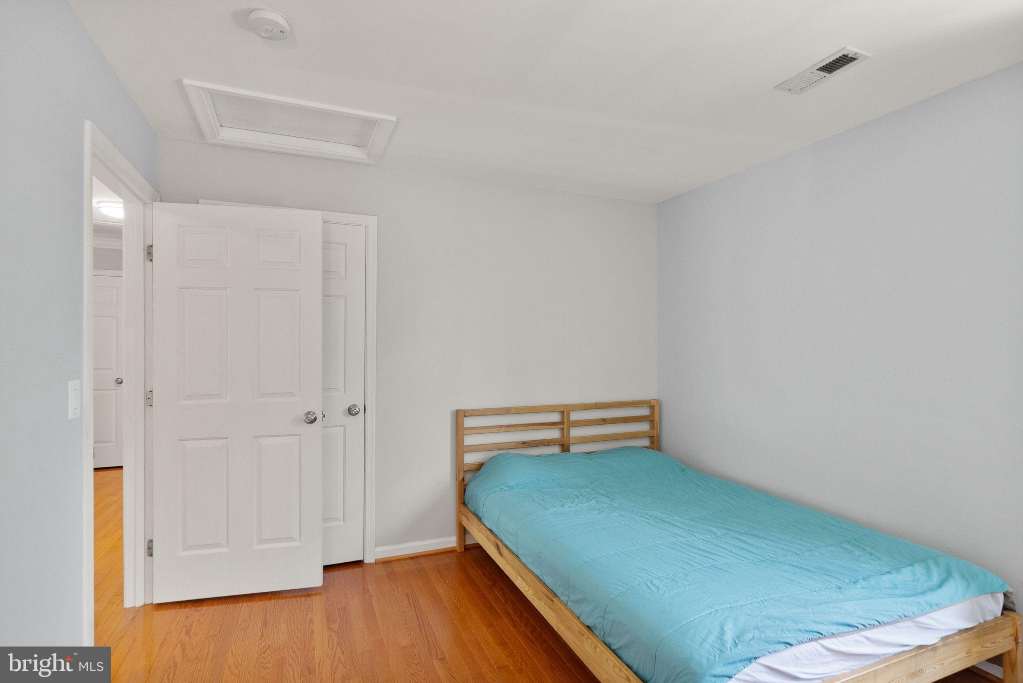 6901 Bitterroot Court Gainesville, VA 20155 - Photo 46 of 98 a room with a chair and wooden floor