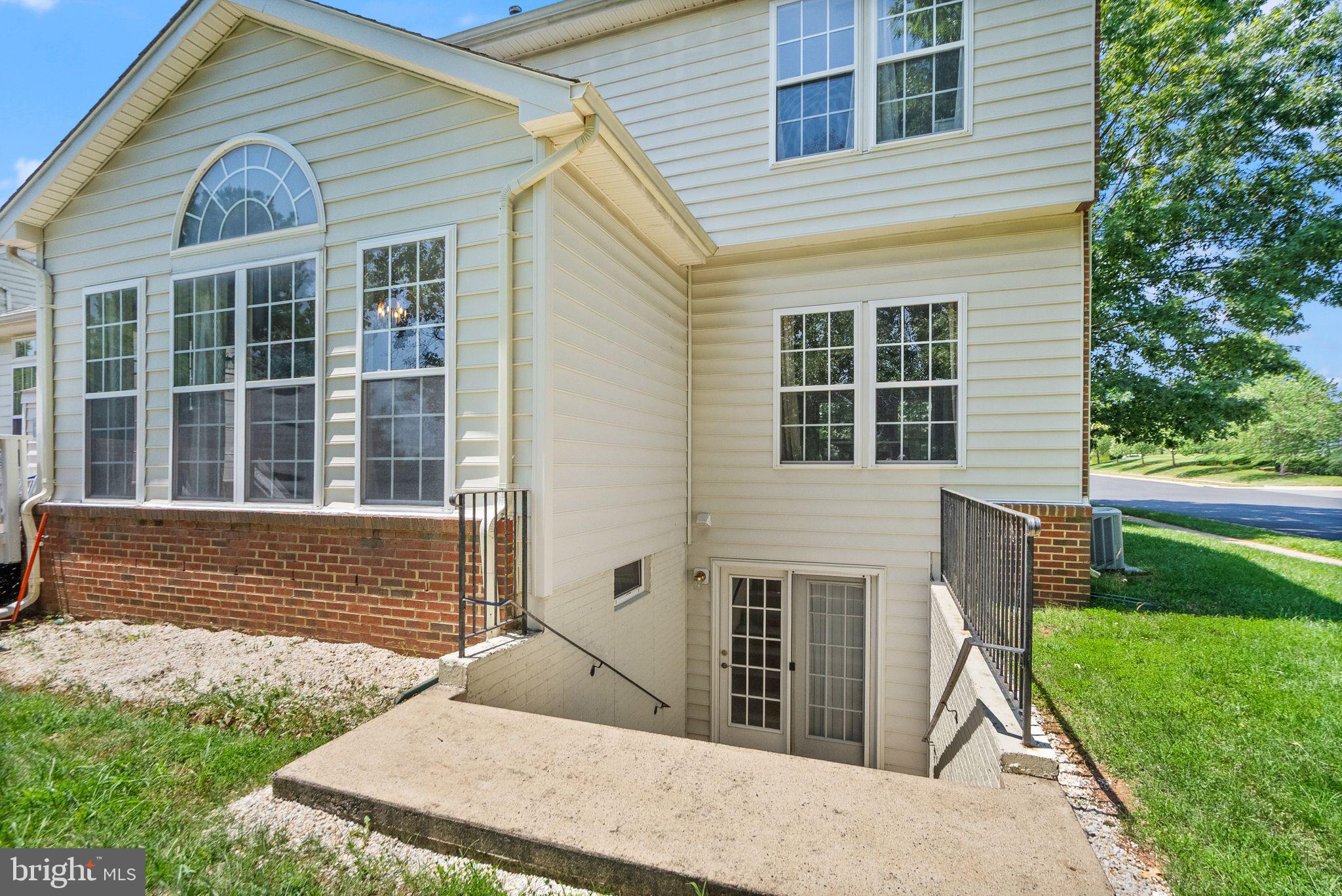 6901 Bitterroot Court Gainesville, VA 20155 - Photo 65 of 98 a front view of a house with a yard