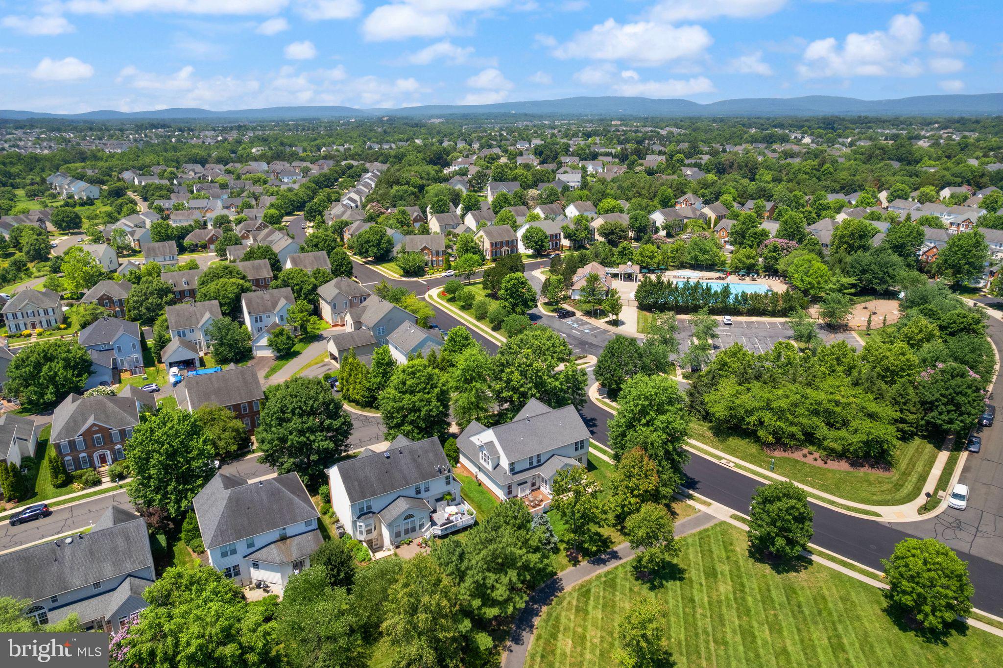 6901 Bitterroot Court Gainesville, VA 20155 - Photo 73 of 98 an aerial view of residential houses with outdoor space and trees