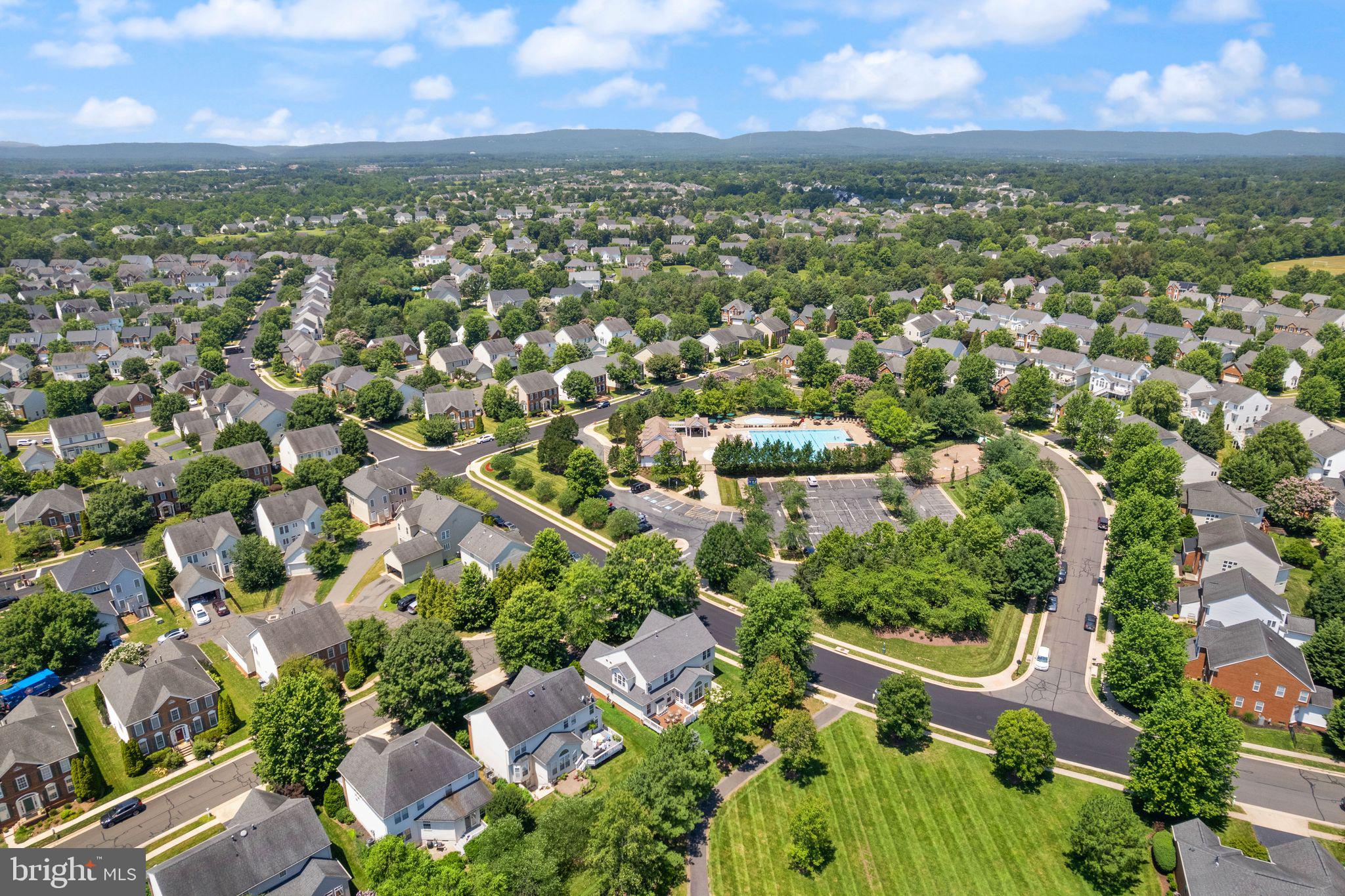 6901 Bitterroot Court Gainesville, VA 20155 - Photo 86 of 98 an aerial view of residential houses with outdoor space and trees