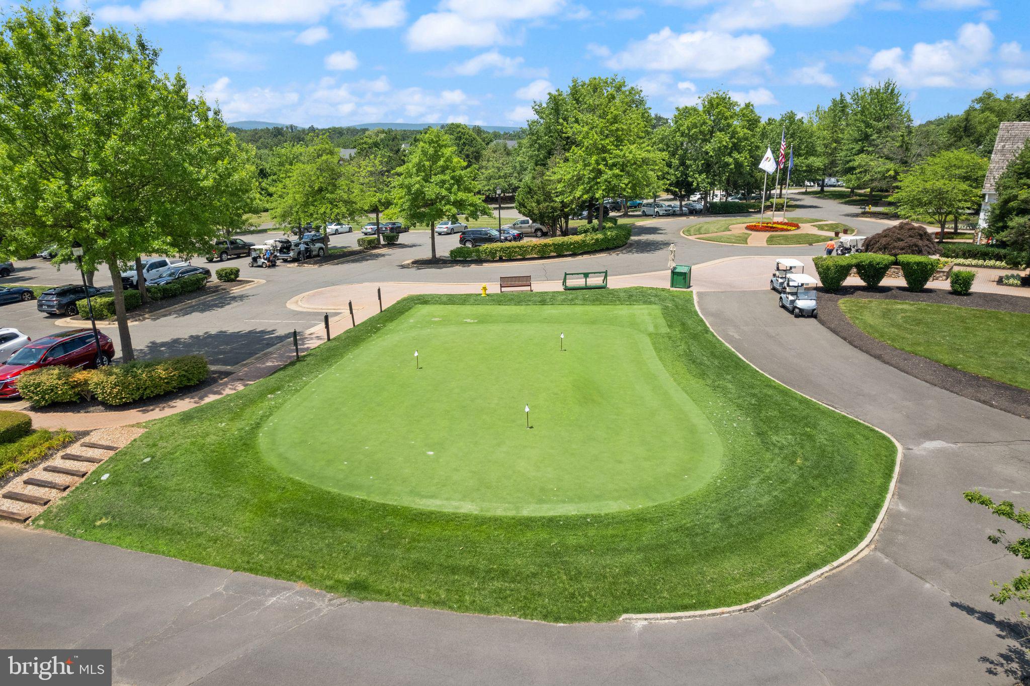 6901 Bitterroot Court Gainesville, VA 20155 - Photo 91 of 98 a view of a swimming pool with a patio and a yard