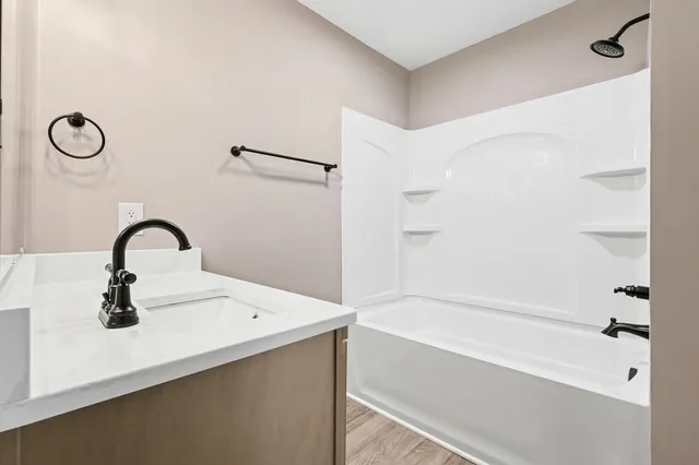 a bathroom with a sink and a bathtub