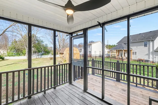 a view of a balcony with wooden floor