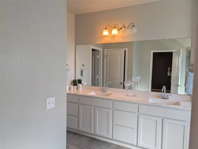 a view of a livingroom with a ceiling fan and window