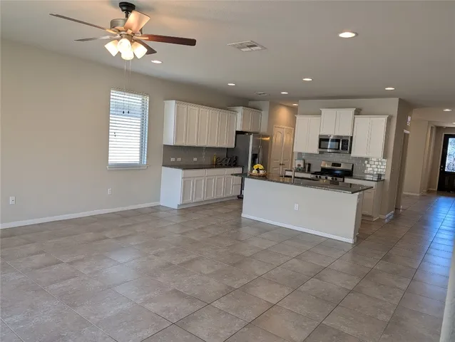 a bathroom with a shower a toilet and a sink