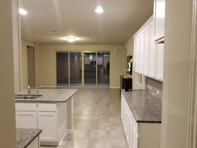 a kitchen with a sink and cabinets