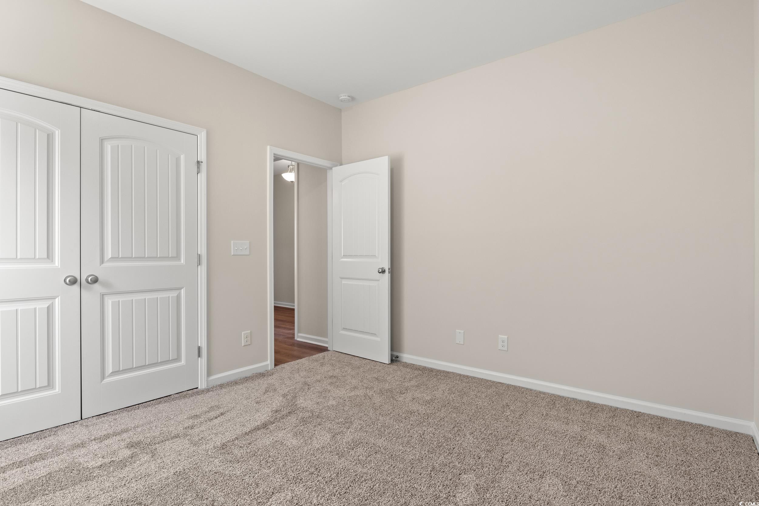 609 Bay Street Aynor, SC 29544 - Photo 6 of 17 Unfurnished bedroom with carpet floors and a closet