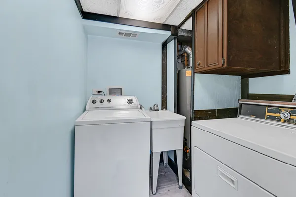 a utility room with dryer and washer