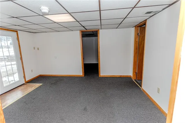 a view of a room with wooden walls